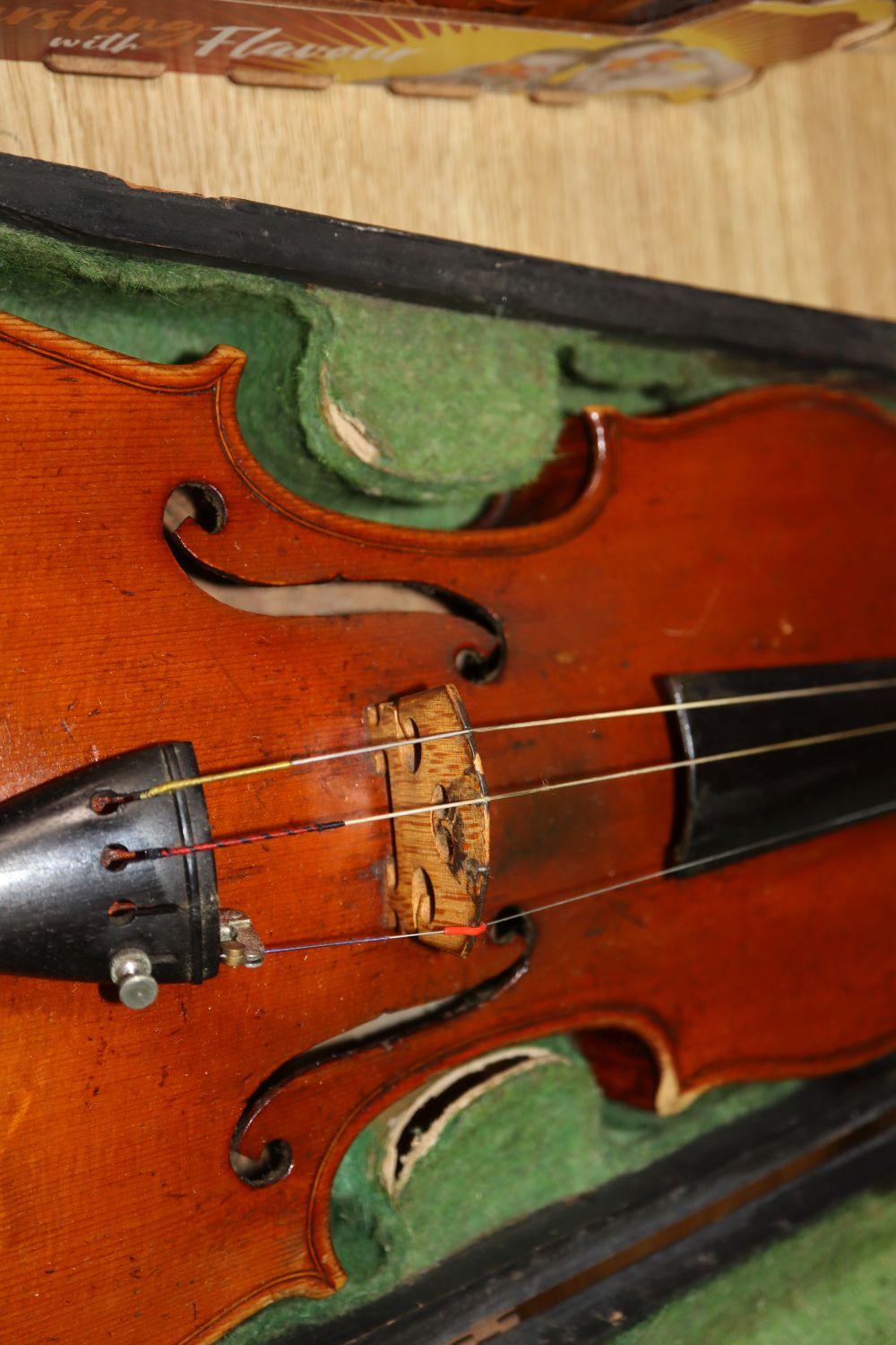 A late 19th century European violin with inlaid decoration, cased with bow, Joseph Guanaris label to interior of violin